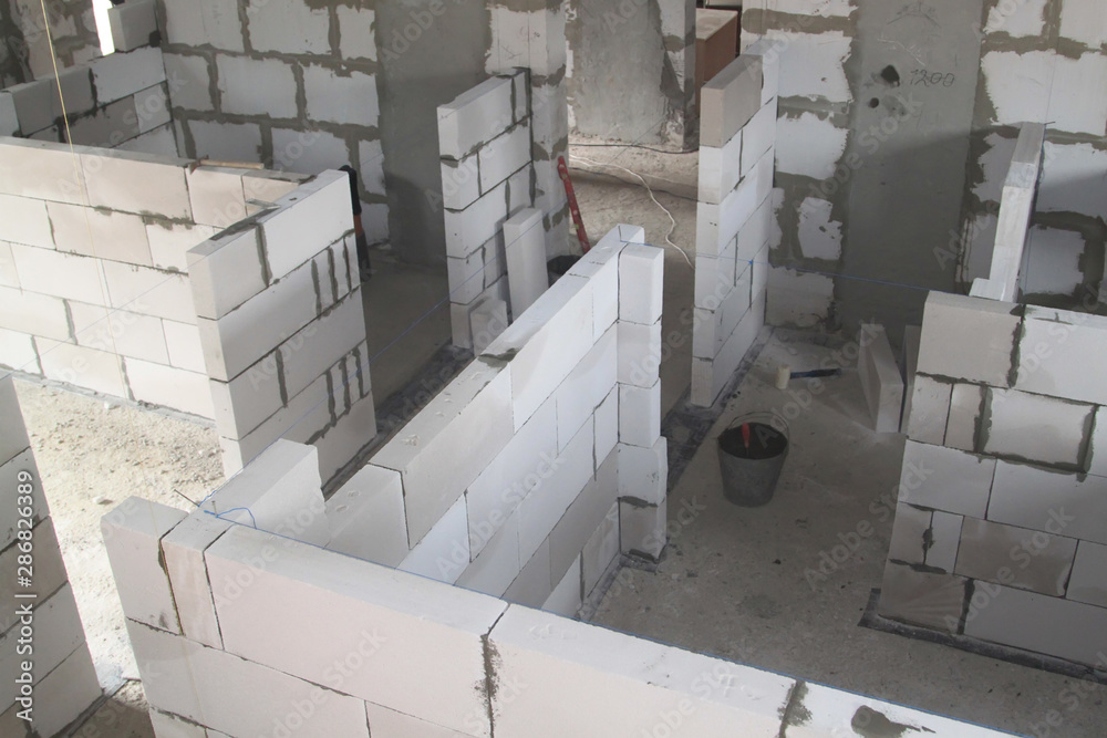 top view of walls under construction of foam blocks in walls of country  house Stock Photo | Adobe Stock