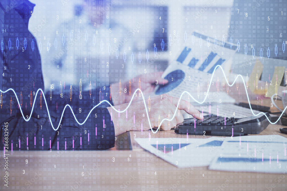Double exposure of graph with man typing on computer in office on background. Concept of hard work. Closeup. Double exposure of graph with man typing on computer in office on background. Concept of hard work. Closeup.