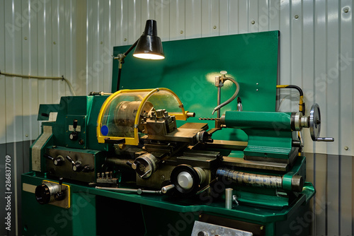 Workplace of a turner. Metal processing technology. Lathe in a car service.