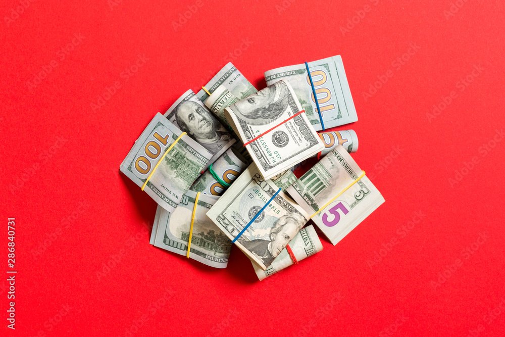 US Dollar bills bundles stack. one hundred dollar bills with stack of money in the middle. Top view of business concept on background with copy space US Dollar bills bundles stack. one hundred dollar bills with stack of money in the middle. Top view of business concept on background with copy space