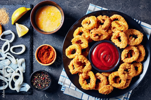 deep fried breaded squids rings, top view photo