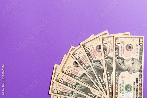 A Hundred dollar currency fan close up, Top view of business concept on colored background with copy space