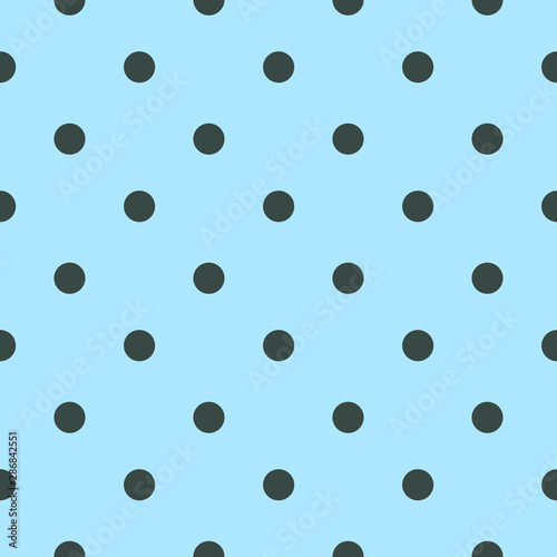 Seamless teal blue polka dot background with dark blue dots.