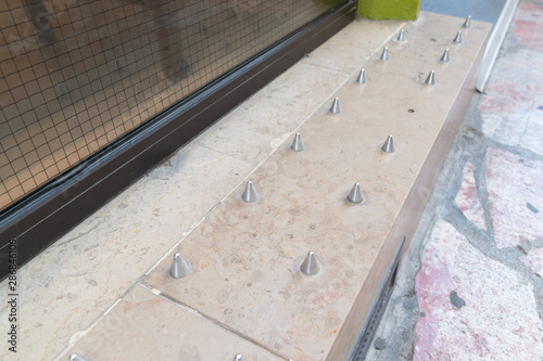 Anti-homeless spikes hostile architecture defensively designed street furniture