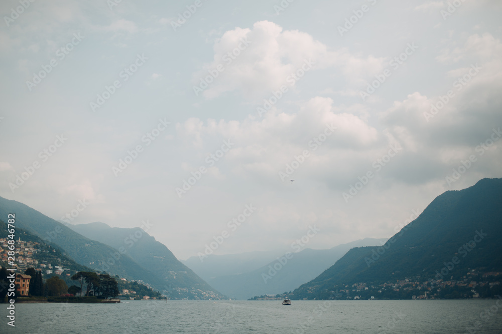 View of Lake Como, Italy. Mountains and water tourism.