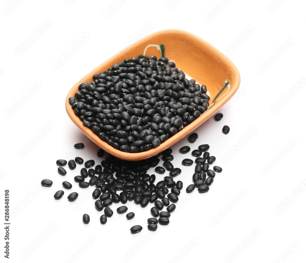 Black beans in clay bowl, pot isolated on white background Black beans in clay bowl, pot isolated on white background
