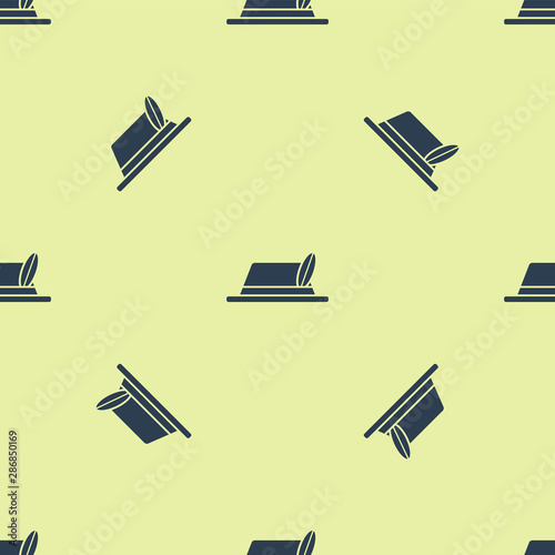 Blue Oktoberfest hat icon isolated seamless pattern on yellow background. Hunter hat with feather. German hat. Vector Illustration