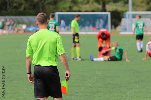 The line referee observes the situation on the football field © wideonet