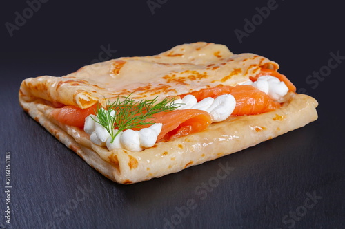 Pancake with salmon and cheese
