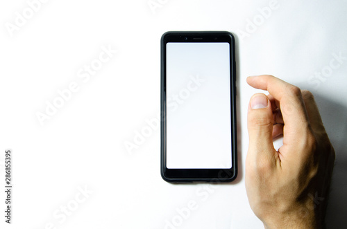 Smartphone in male hands on a white background