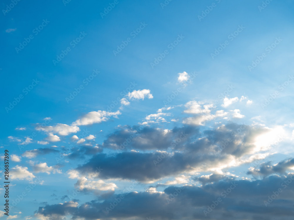 The sky at sunset, Sunny background, blue sky with white clouds, Natural landscape
