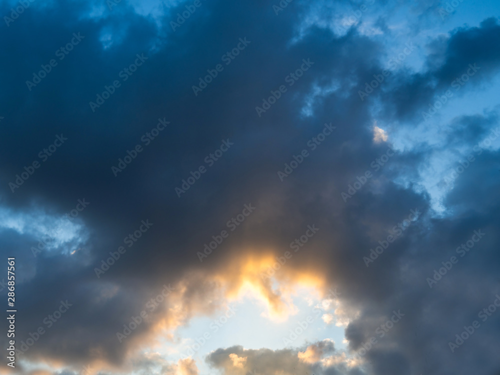 The sky at sunset, Sunny background, blue sky with white clouds, Natural landscape, Cloud tunnel