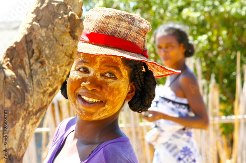 Portrait of malagasy woman with traditional mask on the face, Madagascar photo