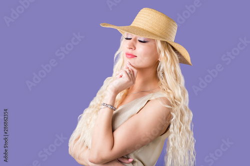 Blonde woman on purple background