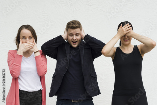 Photography Friends showing symbols of three wise monkeys