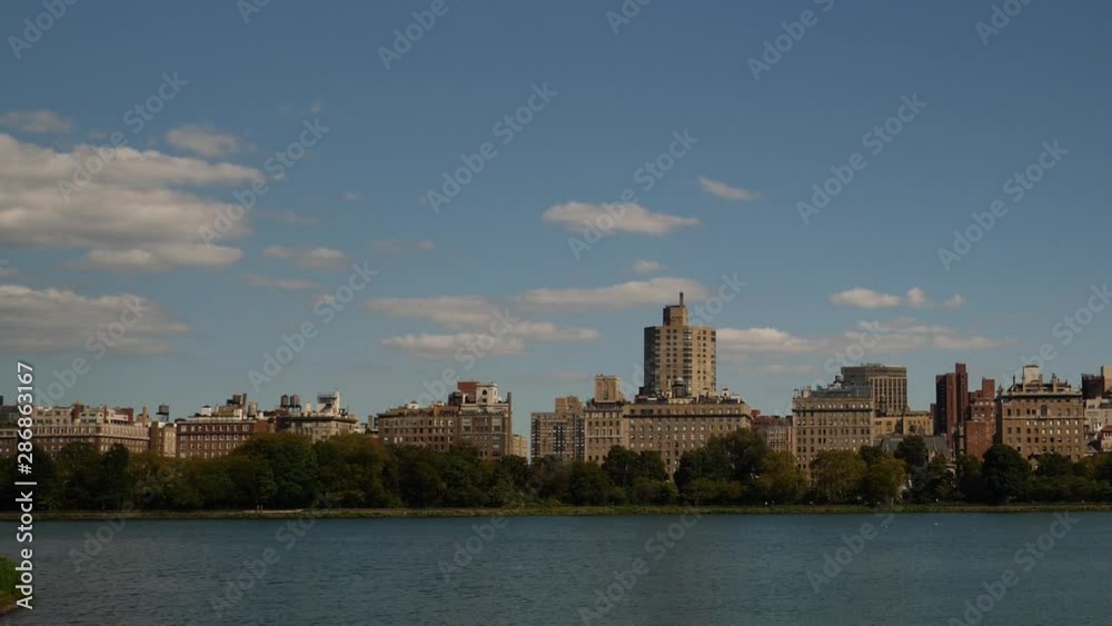Central Park PANNING scene of buildings and water under a Summer Sky. Central Park PANNING scene of buildings and water under a Summer Sky.