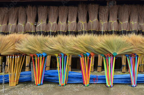 Many pile of colorful broomstick , sorting for sale