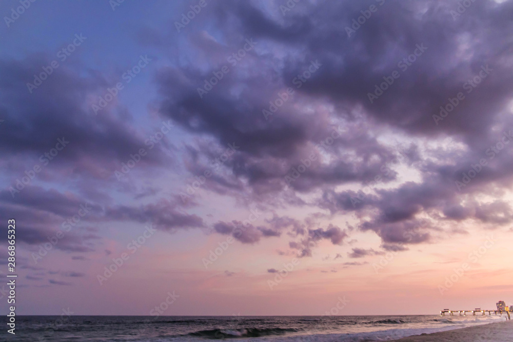 Cotton Candy colored pink and orange sunsets at the beach in Orange Beach, Alabama at the coast