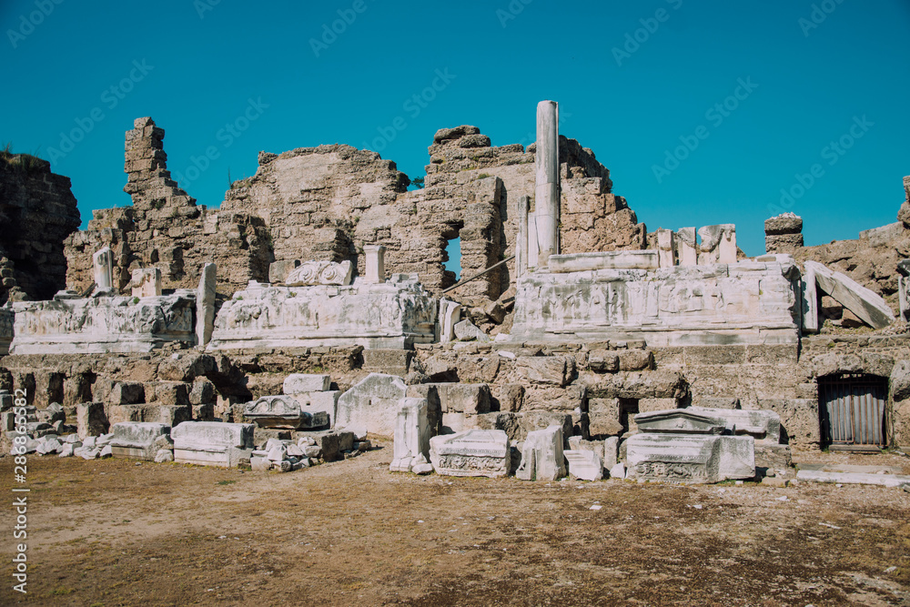Fototapeta premium ancient bas-reliefs. Excavations. The ruins of the ancient city of Turkey. Antalya coast. Antique theater.Ruins of the old theatre. Antalya Province. Pamphylia.Amphitheater in Turkey