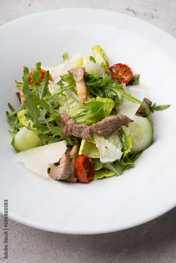 Fresh healthy roastbeef salad with green arugula Fresh healthy roastbeef salad with green arugula