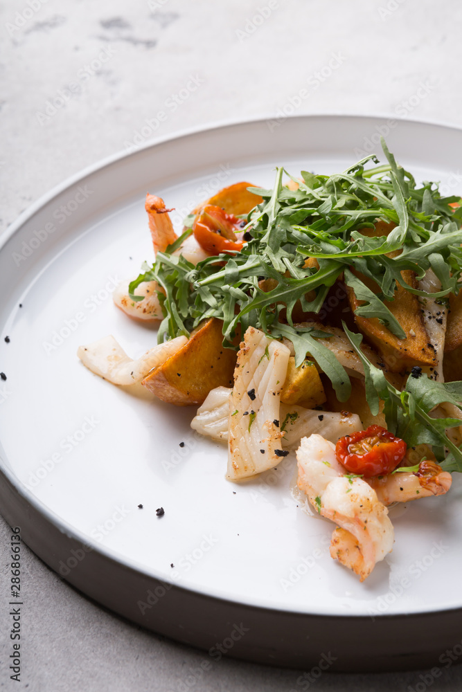 Seafood salad with green arugula Seafood salad with green arugula