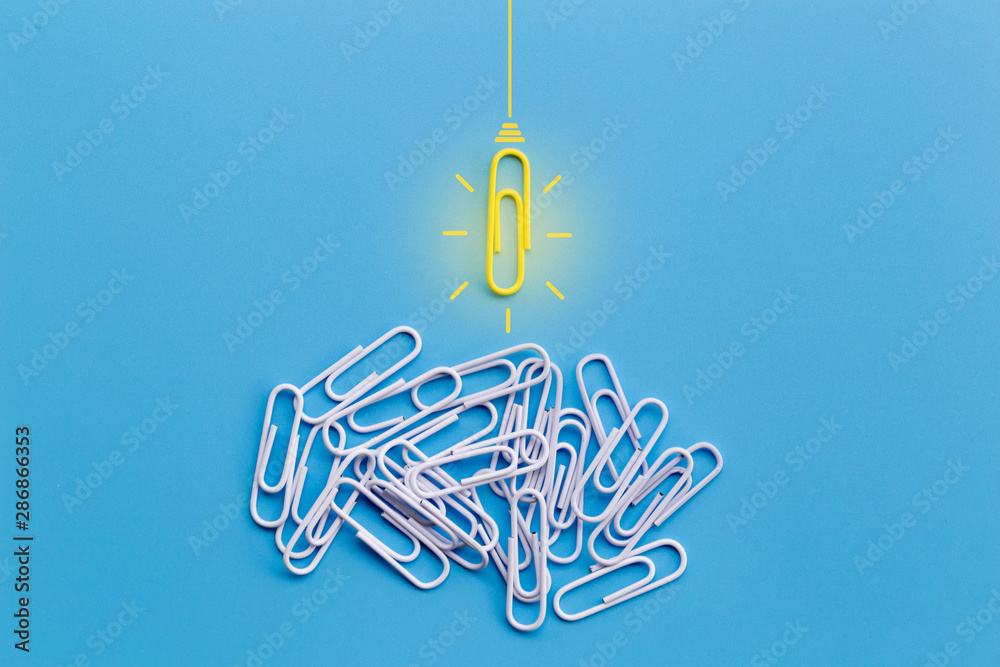 Great ideas concept with paperclip,thinking,creativity,light bulb on blue background,new ideas concept. Great ideas concept with paperclip,thinking,creativity,light bulb on blue background,new ideas concept.