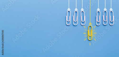 Great ideas concept with paperclip,thinking,creativity,light bulb on blue background,new ideas concept. photo