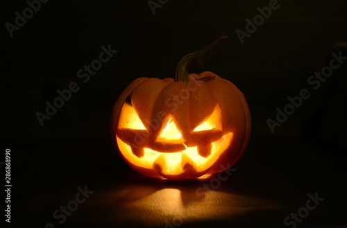 halloween pumpkin on black background with copy space for text