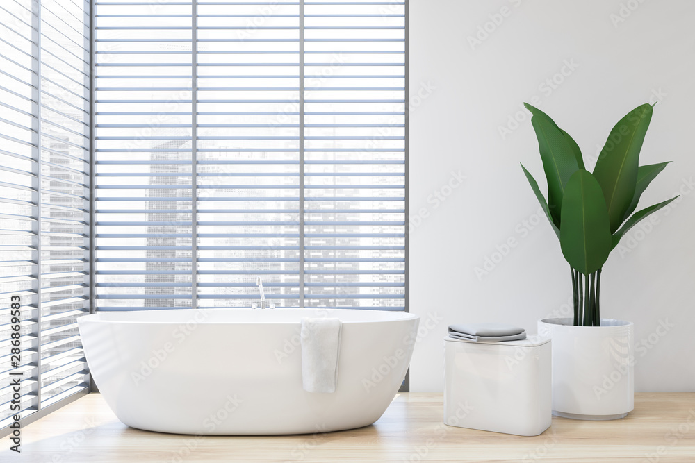 Fototapeta premium Close up of white tub in white bathroom