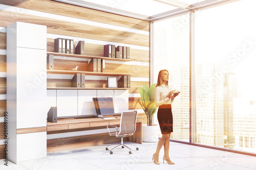 Woman in white and wooden office © ImageFlow