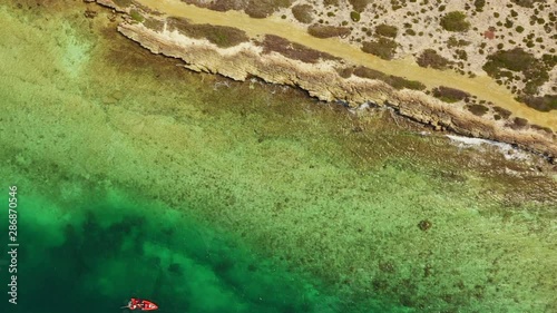 Aerial view of coast of Curaçao in the Caribbean Sea with turquoise water, cliff, beach and beautiful coral reef around Eastpoint photo