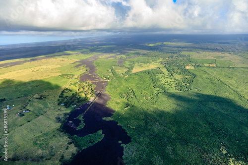 Near Kipuka Mali and Kipuka Puu Kou Lava once flowed like a river eating lush green jungle on the very flat big island of Hawaii