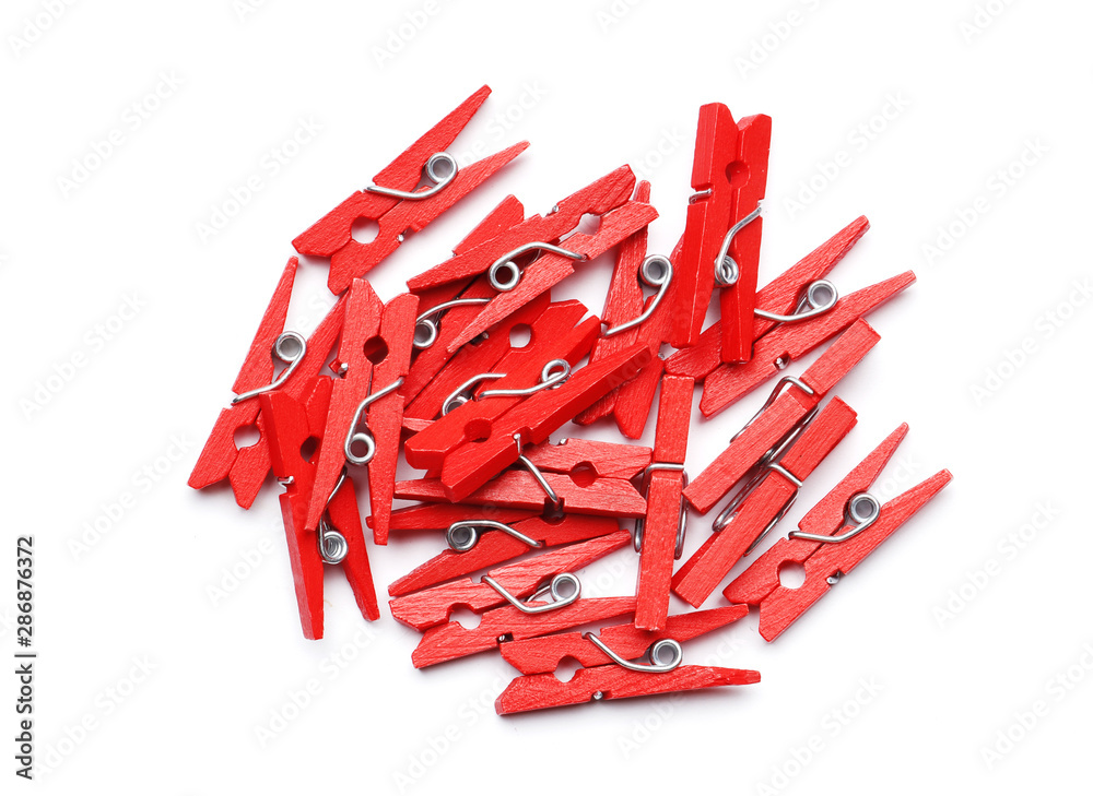 A lot of red clothespin isolated on a white background A lot of red clothespin isolated on a white background