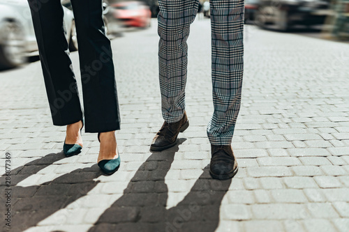 Lady and gentleman walking on the street © Yakobchuk Olena