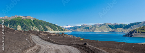 Laguna de La Laja, dirt road and the views of the desert landscape Antuco volcano black volcano desert. Northern Patagonia, Andes, Chile, South America. photo