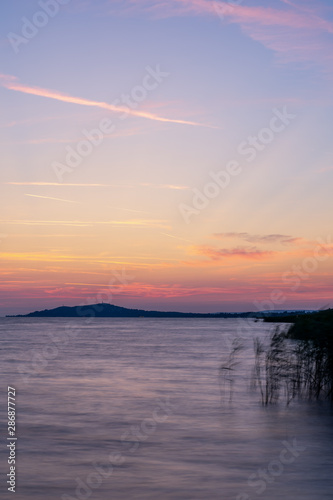 purple sky at sunrise at lake balaton hungary reed 