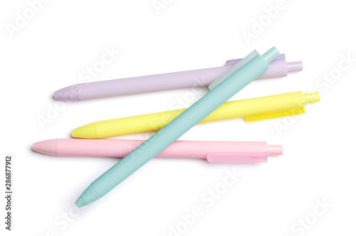 Set of multi-colored pens isolated on a white background. School supplies.
