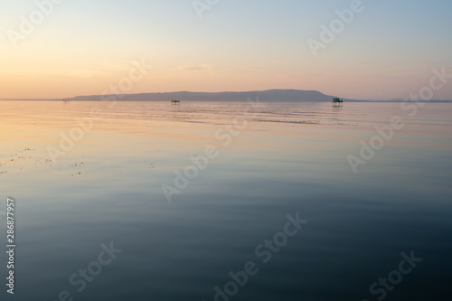 Lake balaton evening sunset in pastel colors. fonyód district hungary summer vacation travel relax romantic