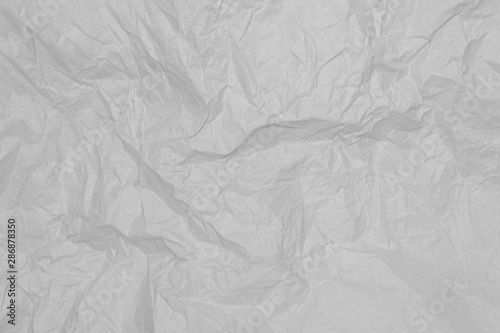 Gray crumpled sheet of paper, background, wallpaper.