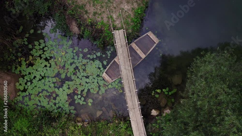 Aerial view of the sunken boat in the river. Abstract scene. 4k resolution.