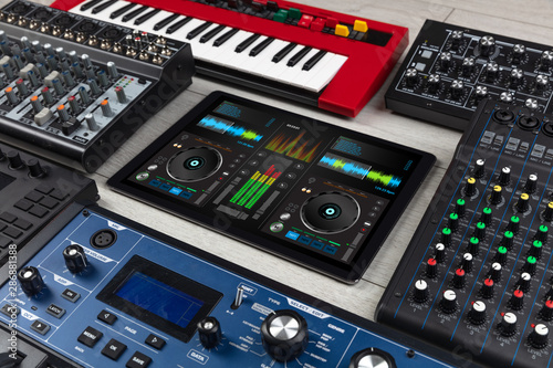 Mixing music on tablet with electronic music instruments concept