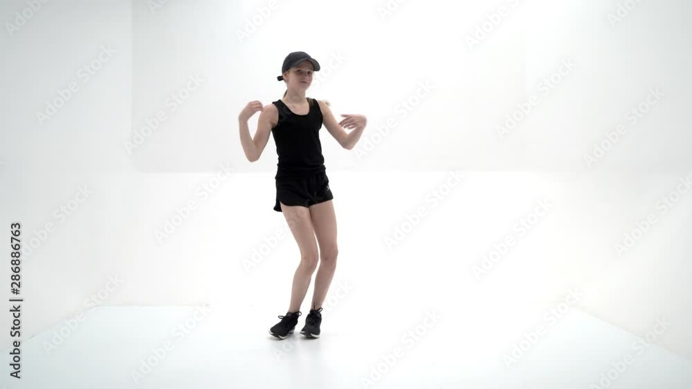 A teenage girl is engaged in fitness. A teenage girl is engaged in fitness.