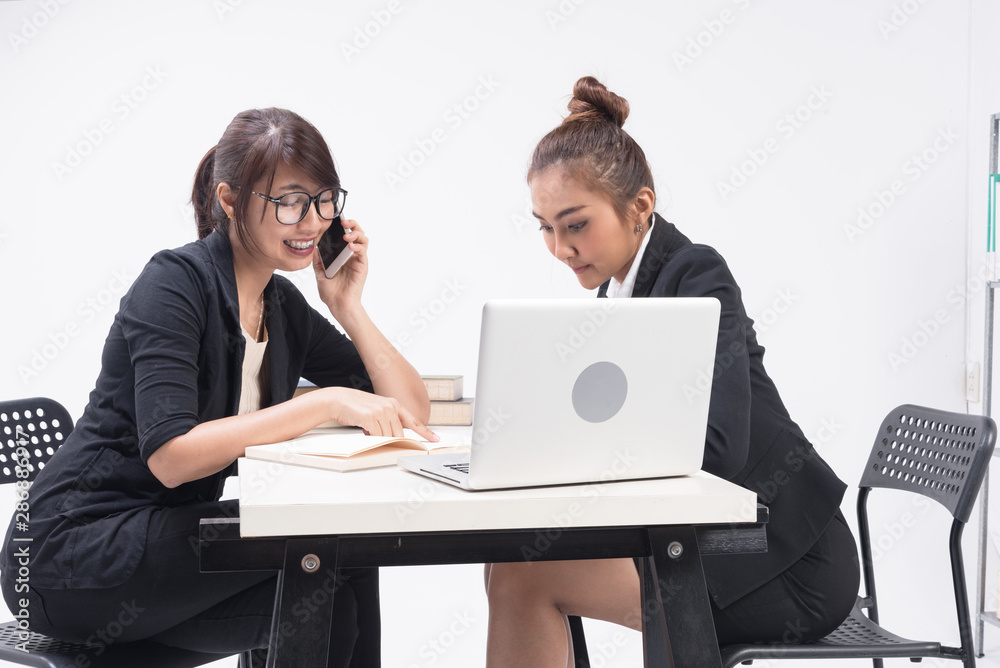 Two business woman work and talk together,Consult and comfort. dispute about problem in work. Two business woman work and talk together,Consult and comfort. dispute about problem in work.