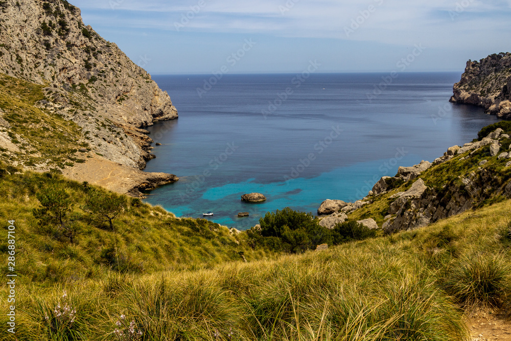 Scenic view on wonderful  rocky bay Cala Figuera on balearic island Mallorca, Spain on a sunny day with clear turquoise water in different colors