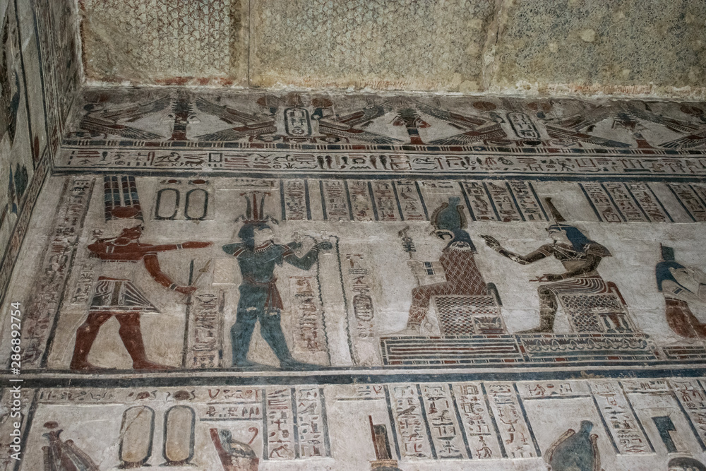 Ancient Egyptian hieroglyphics and wall drawings at Dendera temple, Luxor, Egypt.