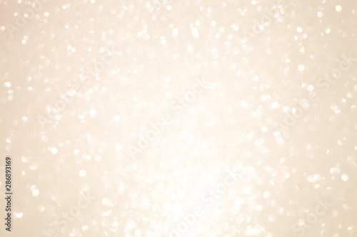 Glowing white silver blurred festive shiny background, perfect backdrop for greeting christmas cards and text