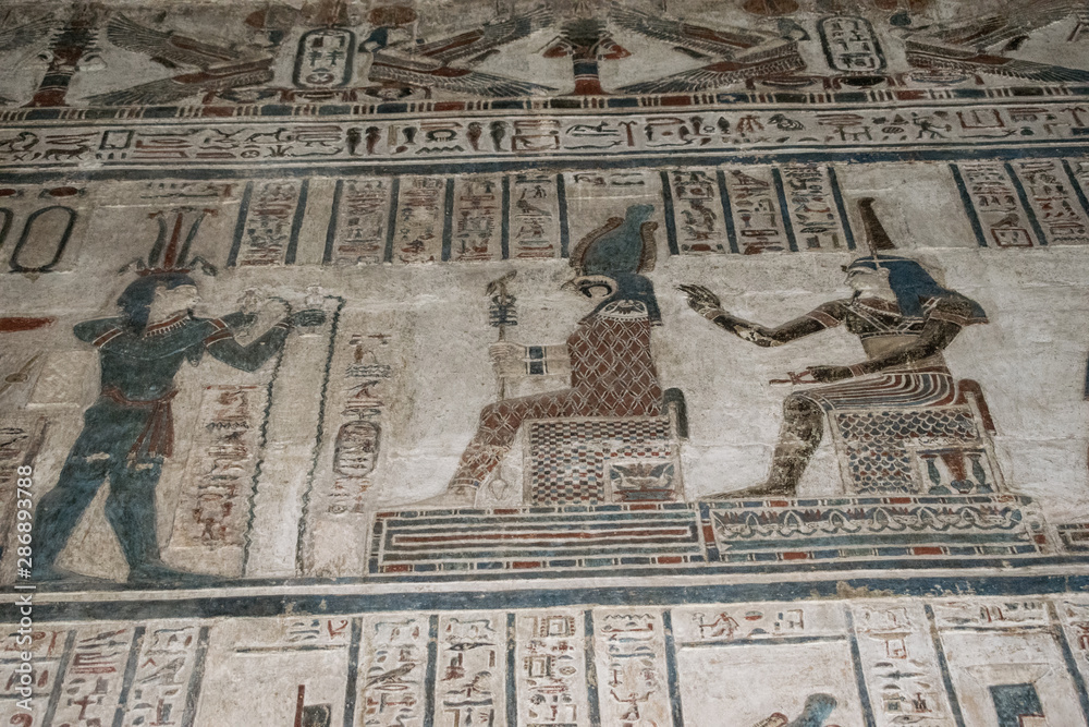 Obraz premium Ancient Egyptian hieroglyphics and wall drawings at Dendera temple, Luxor, Egypt.