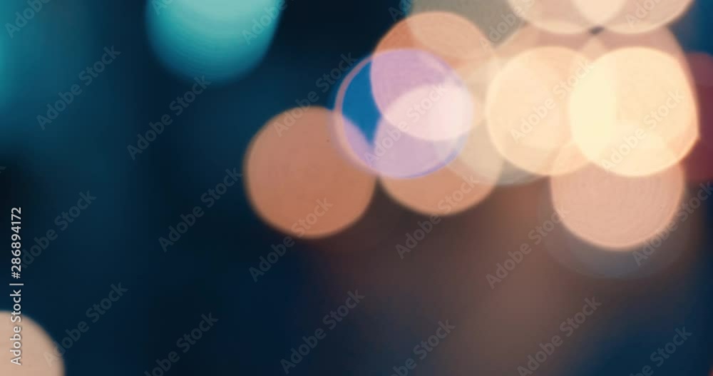 Defocused, blurred bokeh and abstract blurred light of car on street. Royalty high-quality free stock video footage of traffic light, glowing backdrop overlay for design. Traffic light in city night Defocused, blurred bokeh and abstract blurred light of car on street. Royalty high-quality free stock video footage of traffic light, glowing backdrop overlay for design. Traffic light in city night