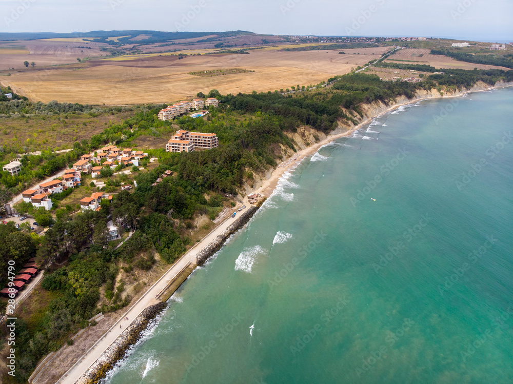 Aerial photo of the beautiful small town and seaside resort of known as Obzor in Bulgaria taken with a drone on a bright sunny day showing the beach and ocean sea front.