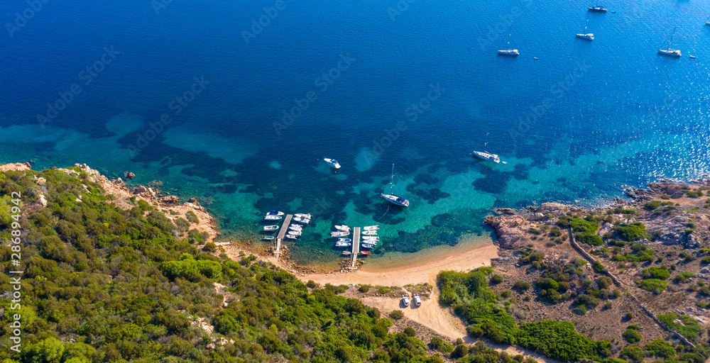 aerial photography with beach, boat and sea